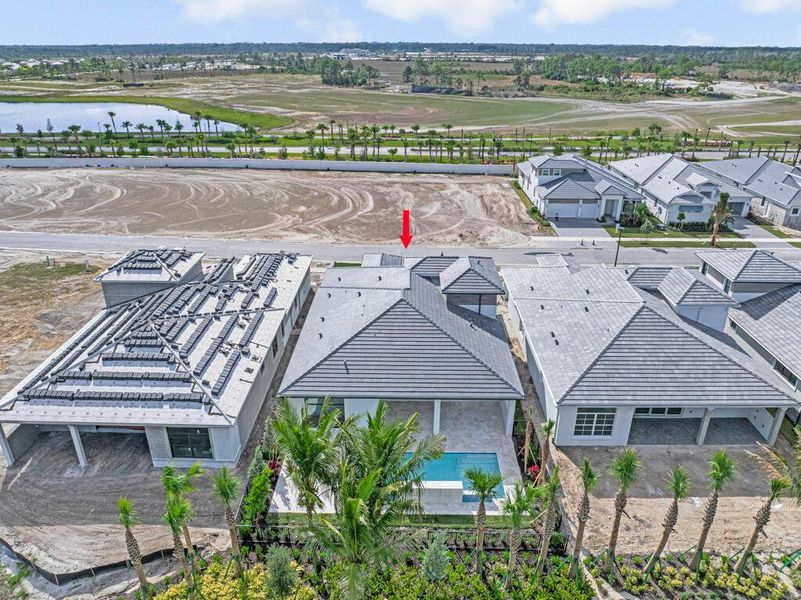 Front exterior of a new home in Esprit at Avenir, Palm Beach Gardens, FL, highlighting curb appeal (Image 24). Front exterior of a new home in Esprit at Avenir, Palm Beach Gardens, FL, highlighting curb appeal (Image 24).