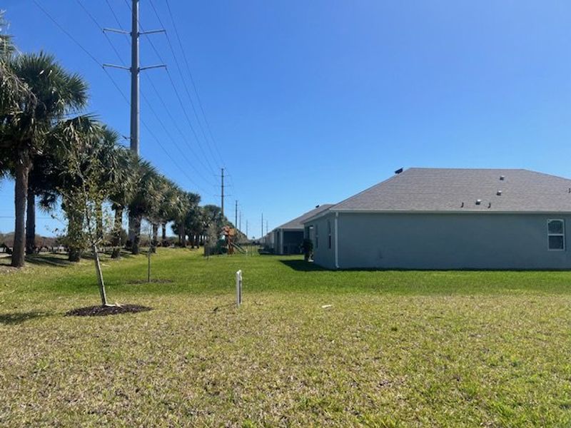 Exterior details and patio area of a home in Lakes At St Sebastian, Micco (Image 21).