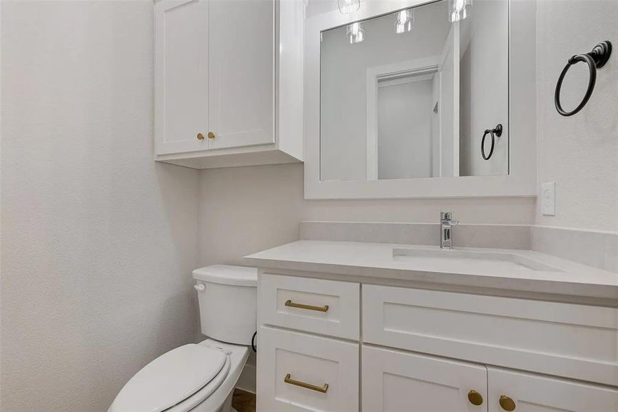Bathroom featuring toilet and vanity