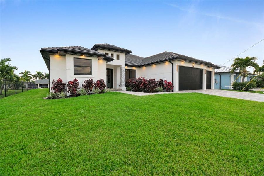 Front exterior of a new home in , Cape Coral, FL, highlighting curb appeal (Image 27).