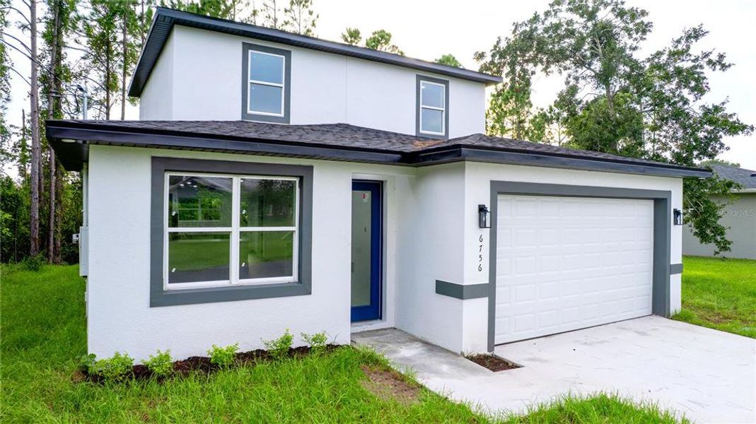 Front exterior of a new home in , St. Cloud, FL, highlighting curb appeal (Image 13). Front exterior of a new home in , St. Cloud, FL, highlighting curb appeal (Image 13).
