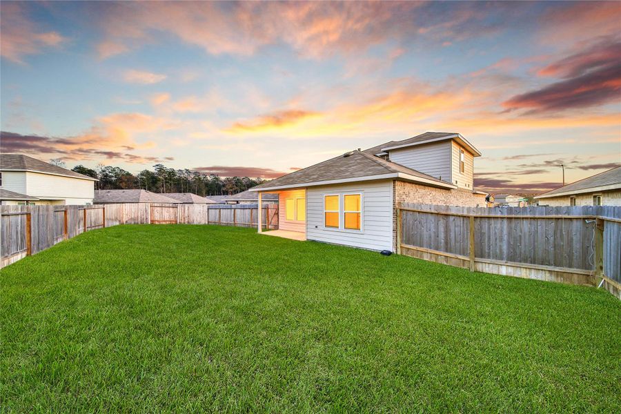 Exterior details and patio area of a home in Breckenridge Forest, Spring (Image 23).