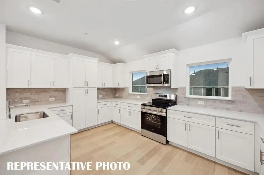 With ample storage and prep space, this over the top kitchen is waiting for you to make it your own!  REPRESENTATIVE PHOTO