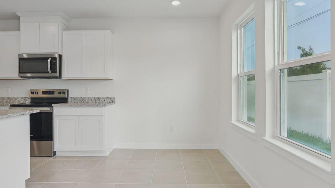 Kitchen of the Coronado - End at Cyrene at Harmony located in St Cloud FL by DRB Homes Kitchen of the Coronado - End at Cyrene at Harmony located in St Cloud FL by DRB Homes