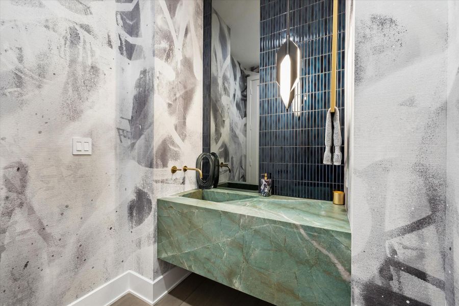 The downstairs powder bathroom off of the main living space. The downstairs powder bathroom off of the main living space.