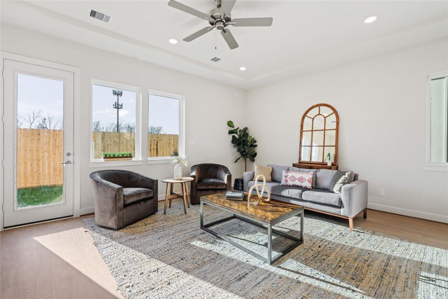 Glass patio doors off the living area connect directly to the backyard, keeping indoor and outdoor in easy reach of each other. Glass patio doors off the living area connect directly to the backyard, keeping indoor and outdoor in easy reach of each other.