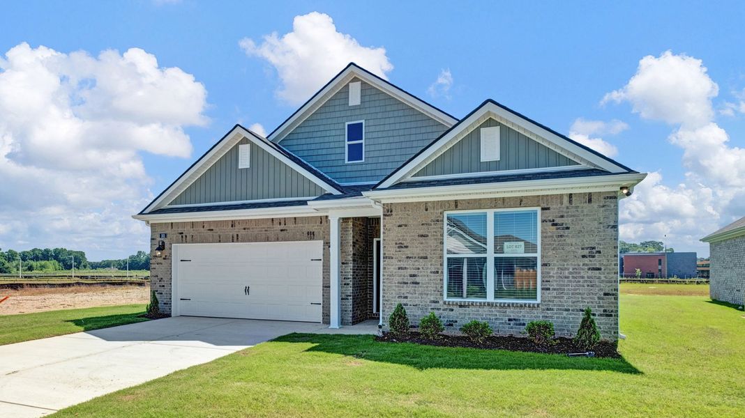 Front exterior of a new home in Shiloh Springs, Jackson, TN, highlighting curb appeal (Image 26). Front exterior of a new home in Shiloh Springs, Jackson, TN, highlighting curb appeal (Image 26).
