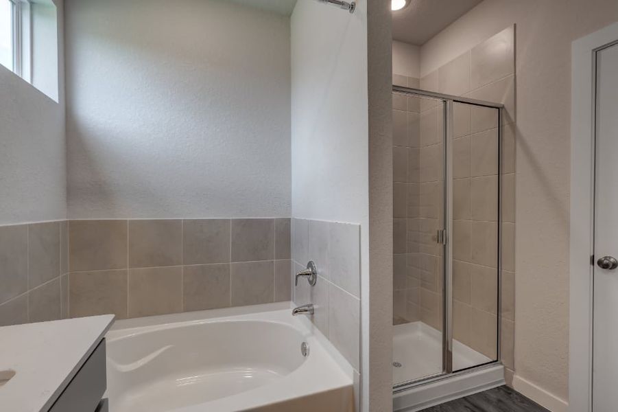 A bathroom with a glass shower. A bathroom with a glass shower.