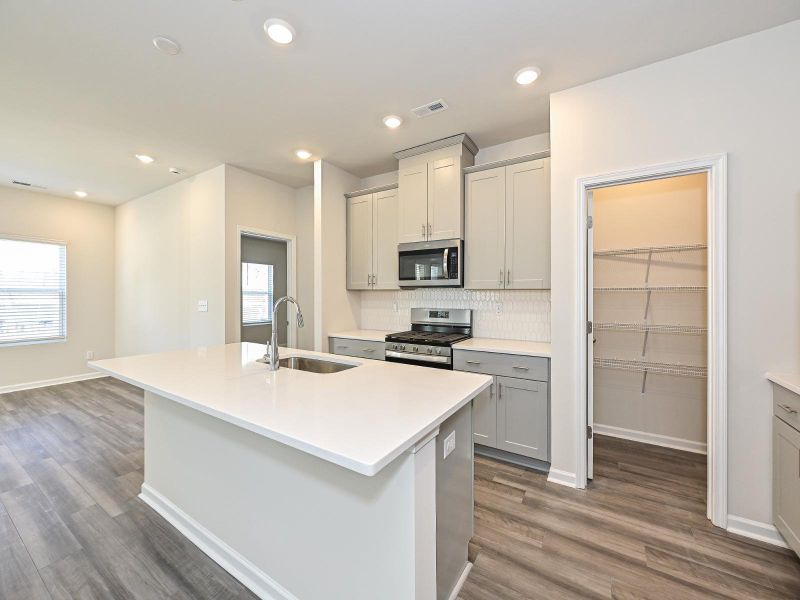 Enjoy your morning coffee at the kitchen island.