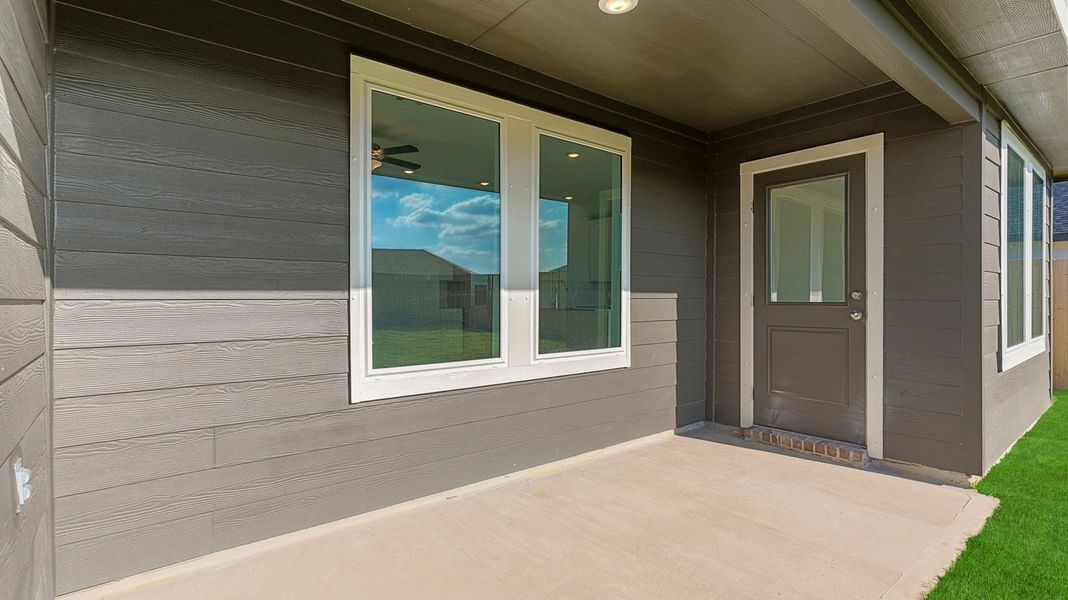 Exterior details and patio area of a home in Caldwell Crossing, Iowa Colony (Image 3). Exterior details and patio area of a home in Caldwell Crossing, Iowa Colony (Image 3).