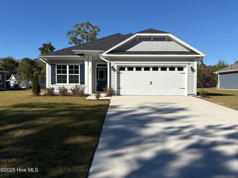 Front exterior of a new home in Rutledge, Shallotte, NC, highlighting curb appeal (Image 1).
