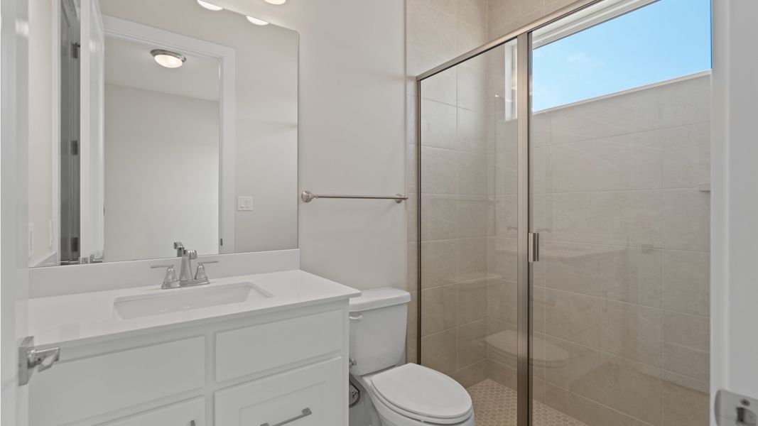 Furnished interior view inside a new home in Glynlea Country Club, Port St. Lucie (Image 9).
