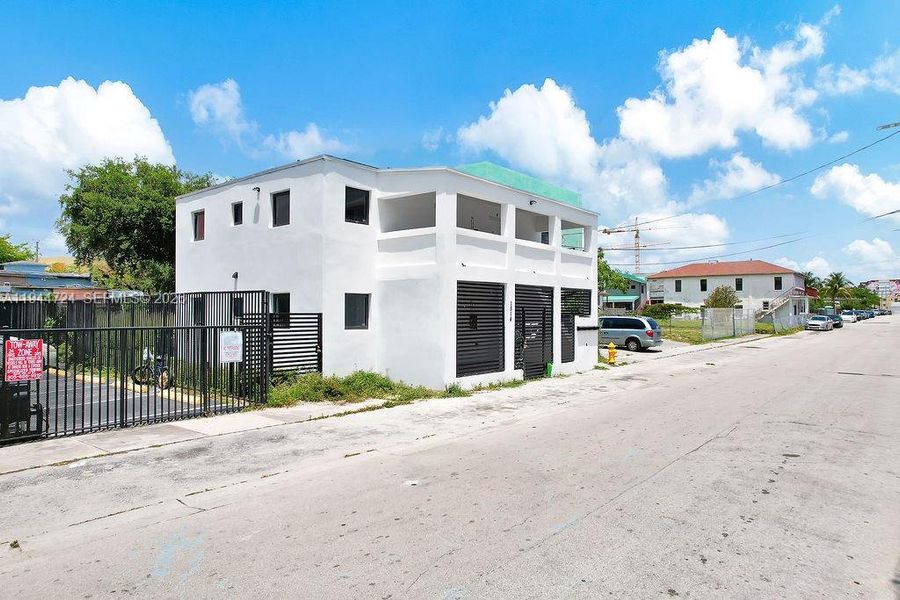 Front exterior of a new home in , Miami, FL, highlighting curb appeal (Image 24).