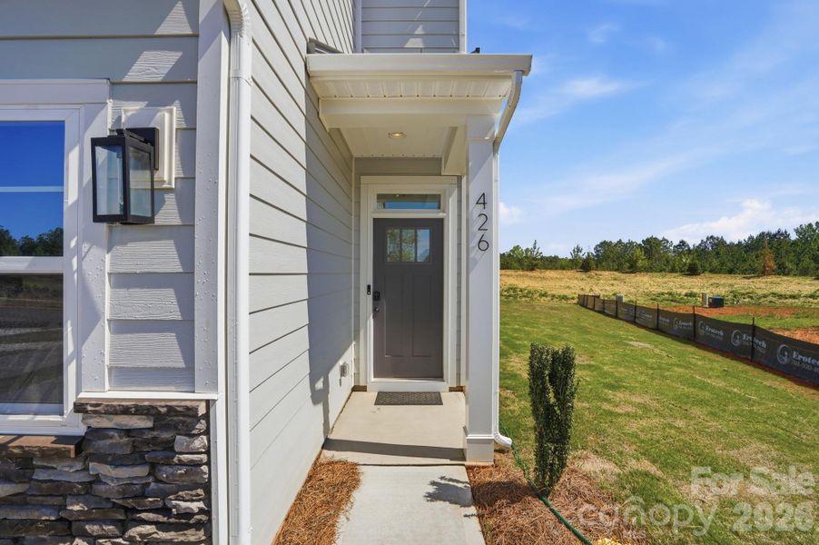 Exterior details and patio area of a home in Blythe Mill Townhomes, Waxhaw (Image 4).