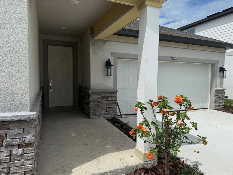 Exterior details and patio area of a home in Oakfield Trails Traditional, Parrish (Image 3).
