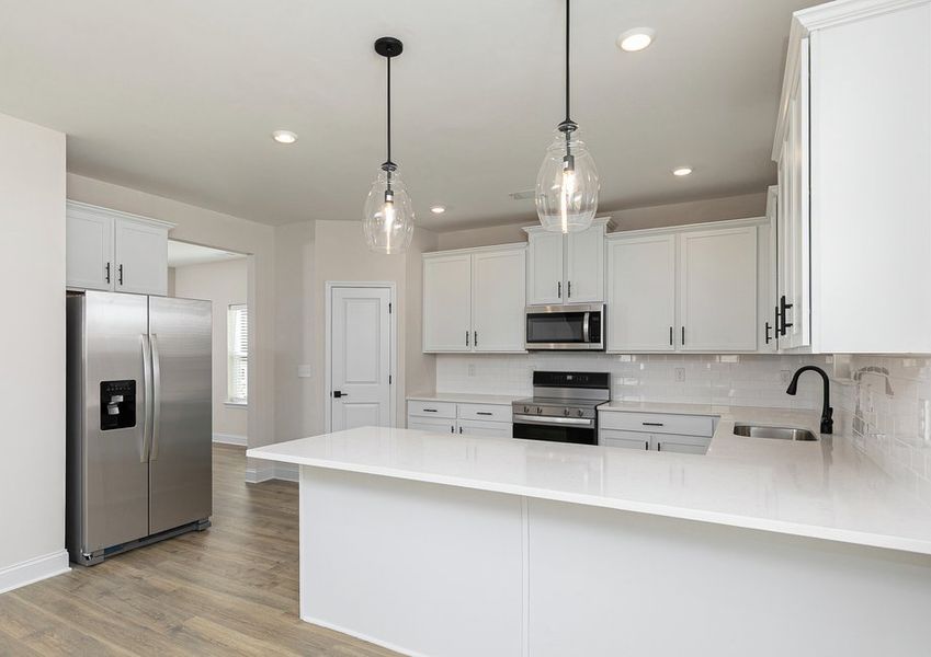 Each kitchen includes stainless steel appliances