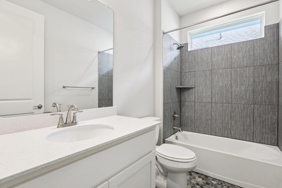 Full bath with shower / bath combination and vanity