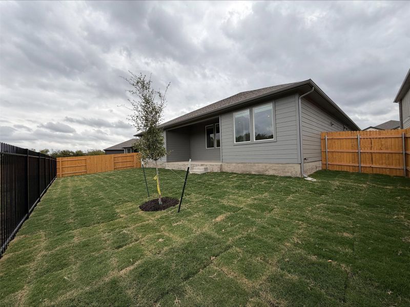 Back of property with a fenced backyard