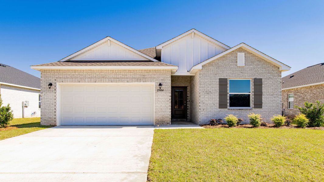 Front exterior of a new home in Oakstone Farms, Leesburg, FL, highlighting curb appeal (Image 25).