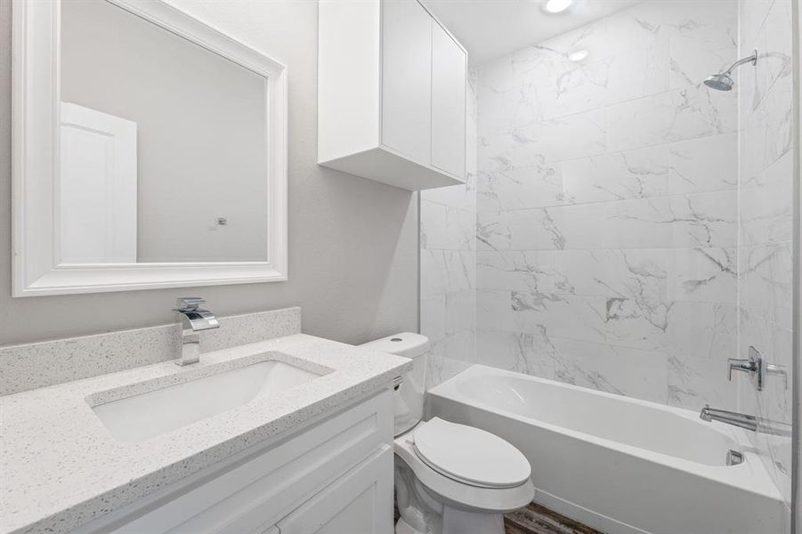 Full bath featuring shower / washtub combination and vanity Full bath featuring shower / washtub combination and vanity