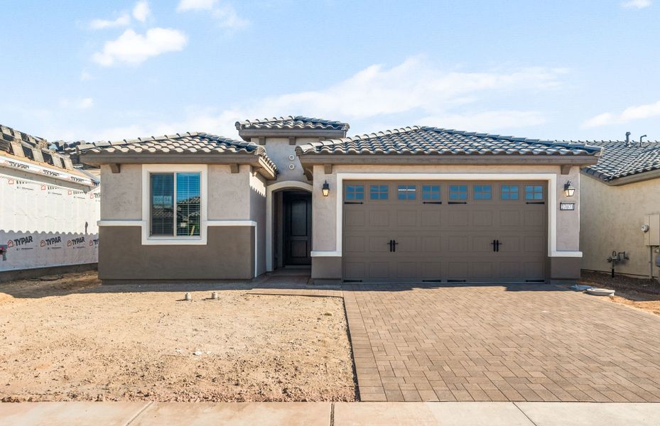 Front exterior of a new home in Sun City Festival, Buckeye, AZ, highlighting curb appeal (Image 2). Front exterior of a new home in Sun City Festival, Buckeye, AZ, highlighting curb appeal (Image 2).