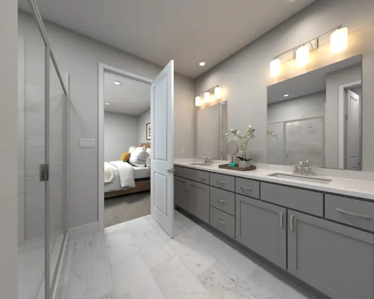 The primary bathroom offers dual vanity sinks and a walk-in shower. The primary bathroom offers dual vanity sinks and a walk-in shower.
