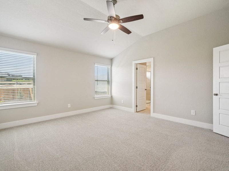 Primary suite in the Red River floorplan at a Meritage Homes community.