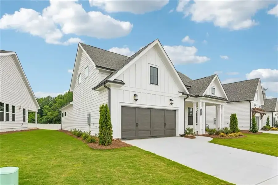 Front exterior of a new home in Aberdeen, Hoschton, GA, highlighting curb appeal (Image 22).