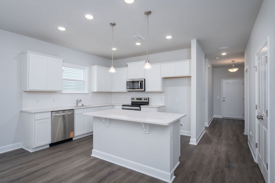 Open Kitchen with white cabinets and granite countertops. Open Kitchen with white cabinets and granite countertops.