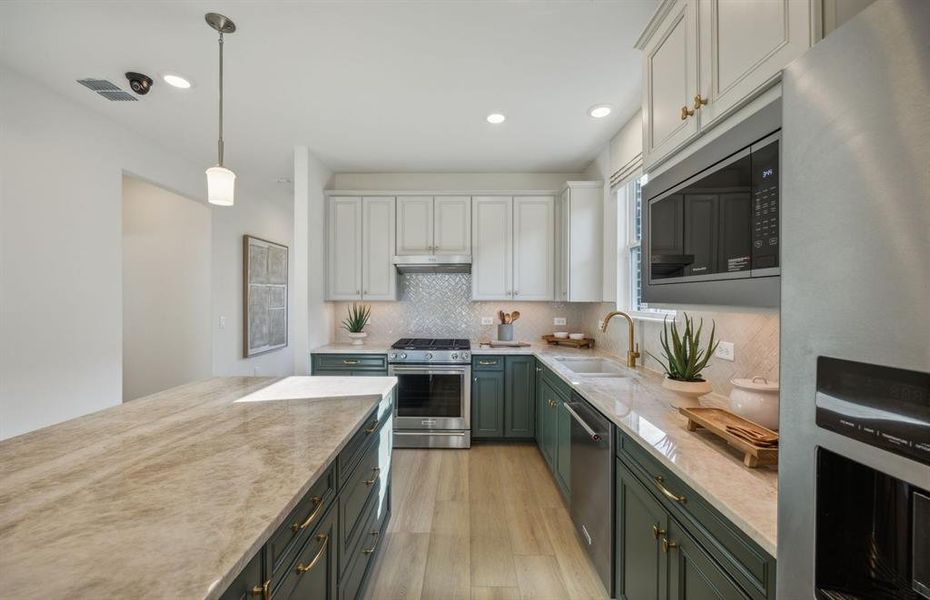 Eat in kitchen features large island *Model representation