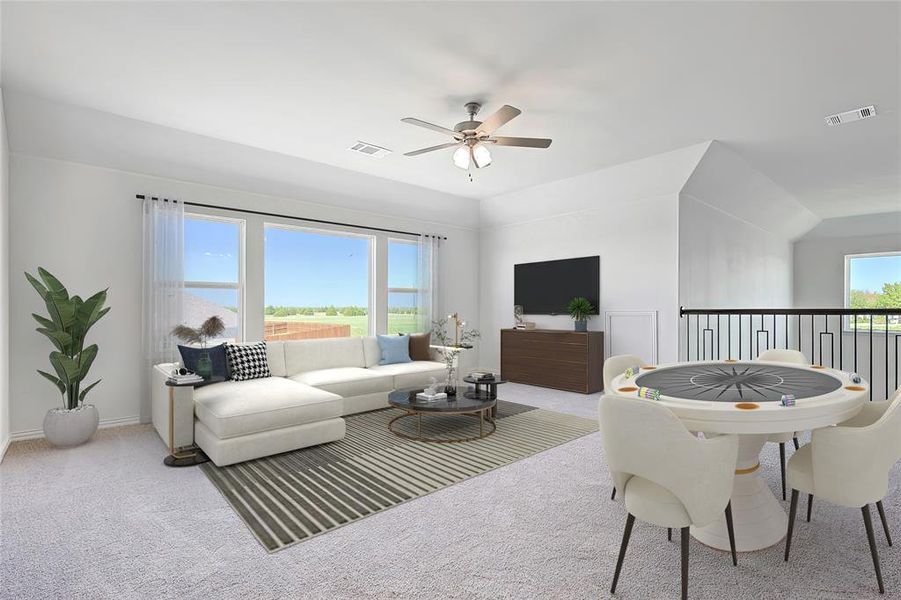 Carpeted living room featuring lofted ceiling and ceiling fan