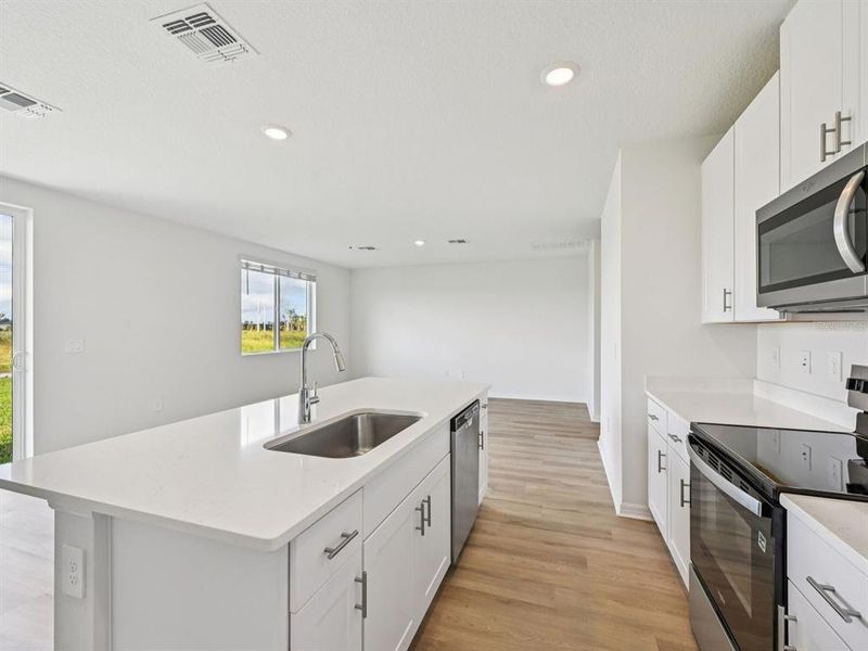 Furnished interior view inside a new home in Oakfield Trails - Signature Series, Parrish (Image 12).