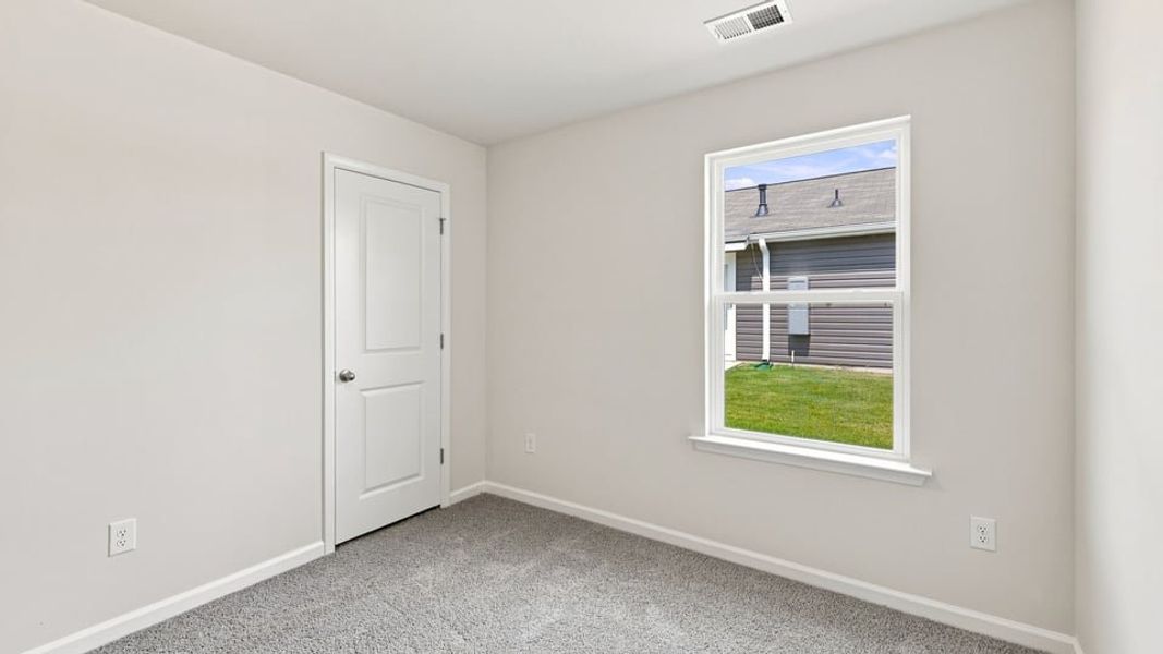 Spacious, unfurnished interior of a new home in Village 3, Woodruff (Image 22).