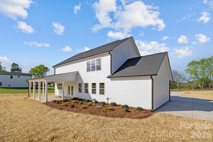 Front exterior of a new home in , Monroe, NC, highlighting curb appeal (Image 22).
