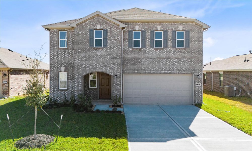 Front exterior of a new home in Vida Costera, Texas City, TX, highlighting curb appeal (Image 20).