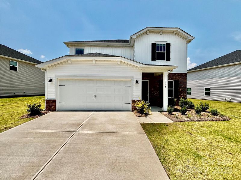 Front exterior of a new home in Harper Landing, Stanley, NC, highlighting curb appeal (Image 1). Front exterior of a new home in Harper Landing, Stanley, NC, highlighting curb appeal (Image 1).