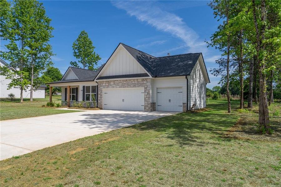 Front exterior of a new home in , Good Hope, GA, highlighting curb appeal (Image 23).