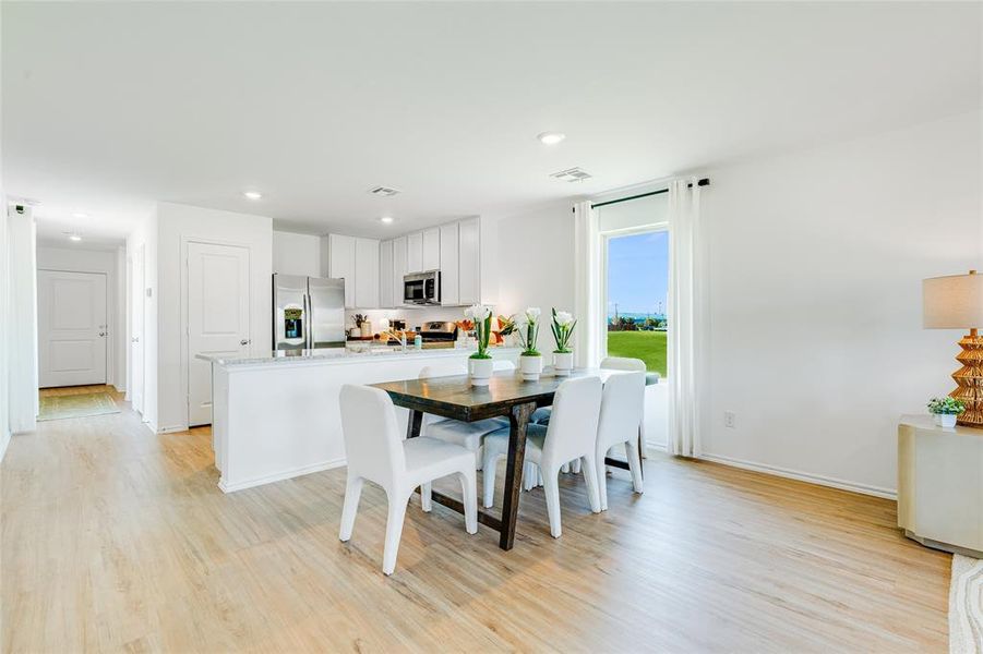 Dining area featuring light wood-type flooring