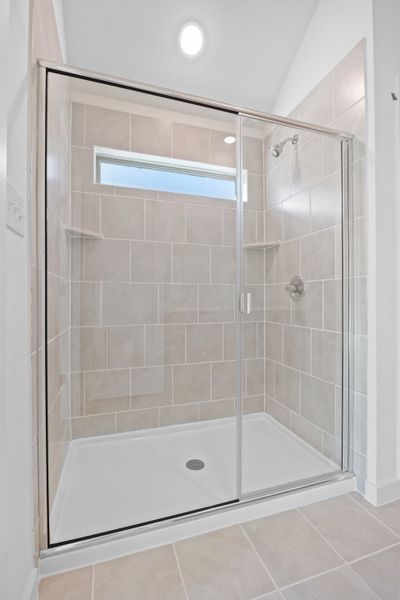 Primary Bath in the Quartz home plan by Trophy Signature Homes – REPRESENTATIVE PHOTO
