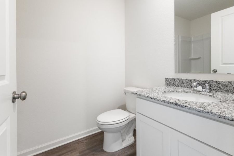 A bathroom with a marble countertop. A bathroom with a marble countertop.