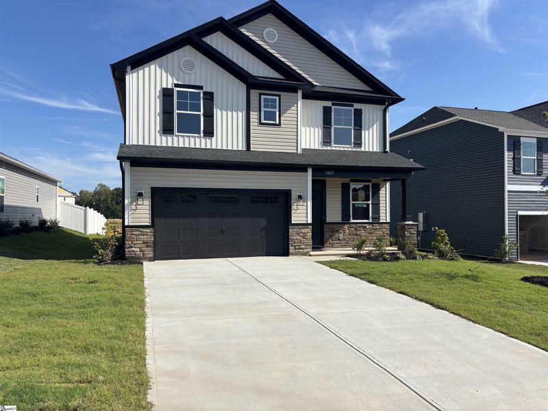 Front exterior of a new home in Halton Oaks, Spartanburg, SC, highlighting curb appeal (Image 17).