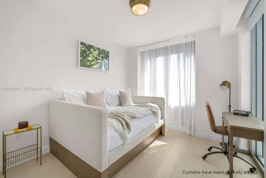 Light-toned wood-finish flooring, floor-to-ceiling windows, and brass-finish flush mount lighting Light-toned wood-finish flooring, floor-to-ceiling windows, and brass-finish flush mount lighting