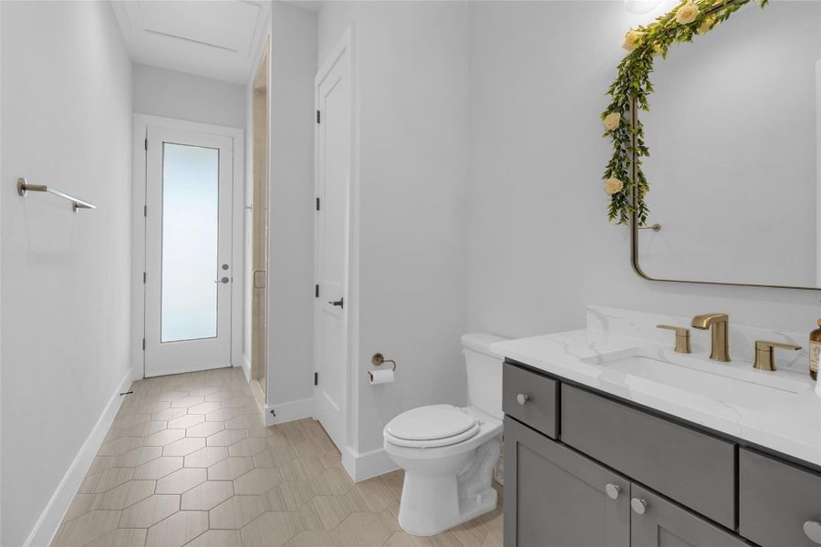 Additional bathroom featuring a spacious vanity and contemporary design.