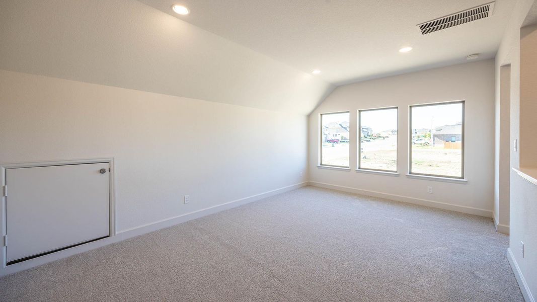 Bonus room featuring vaulted ceiling, carpet floors, and recessed lighting Bonus room featuring vaulted ceiling, carpet floors, and recessed lighting