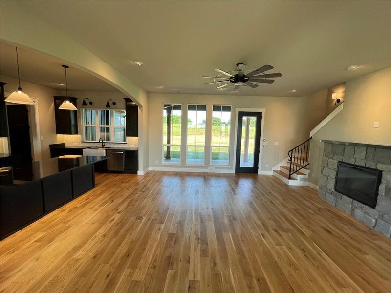 Open-concept living area with wood-finish flooring
