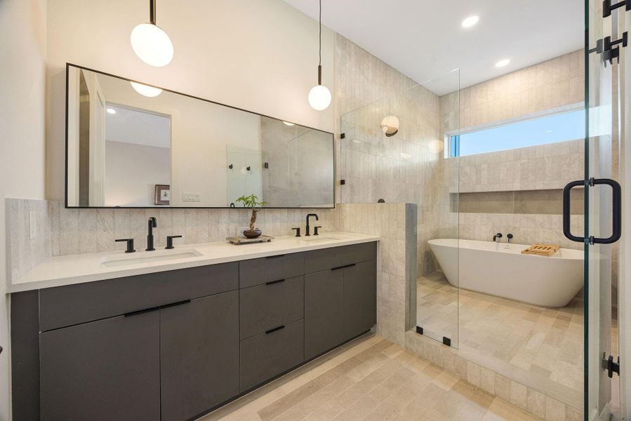 This primary bathroom offers storage, a wet area that combines tub and shower weith relaxing colors and selections. This primary bathroom offers storage, a wet area that combines tub and shower weith relaxing colors and selections.