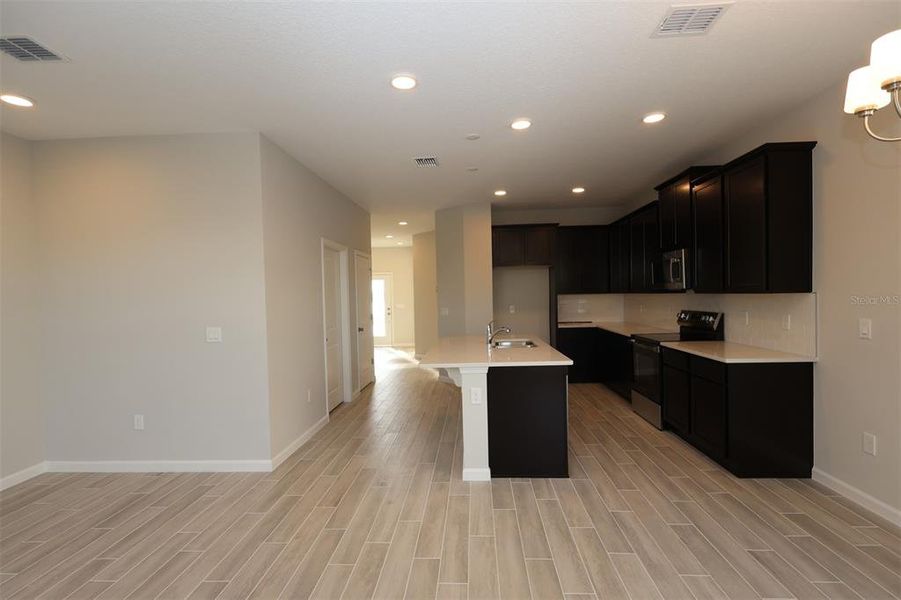 Spacious, unfurnished interior of a new home in Tribute at Ovation, Winter Garden (Image 30).