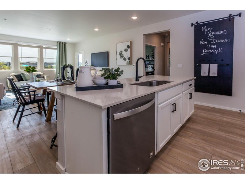 EXAMPLE PHOTO: KITCHEN OPEN TO DINING AND LIVING