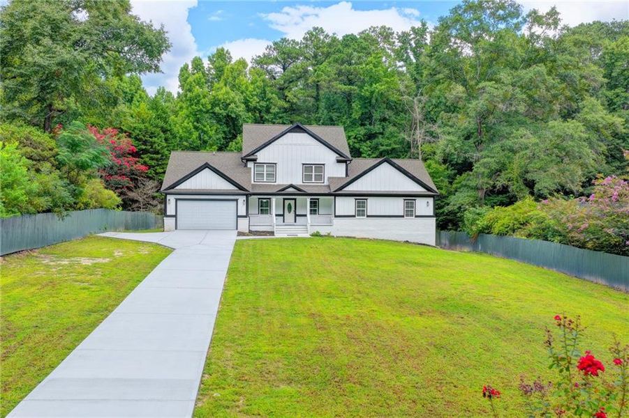 Front exterior of a new home in , Snellville, GA, highlighting curb appeal (Image 33). Front exterior of a new home in , Snellville, GA, highlighting curb appeal (Image 33).