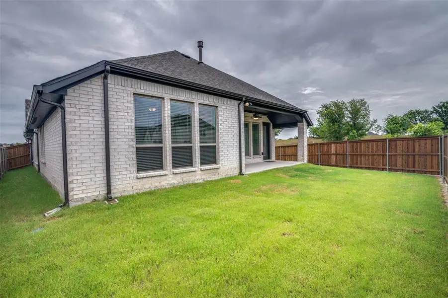 Exterior details and patio area of a home in Devonshire, Forney (Image 20).
